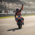 Marc Marquez stands on his MotoGP bike and celebrates his victory at the 2026 Spanish Grand Prix.